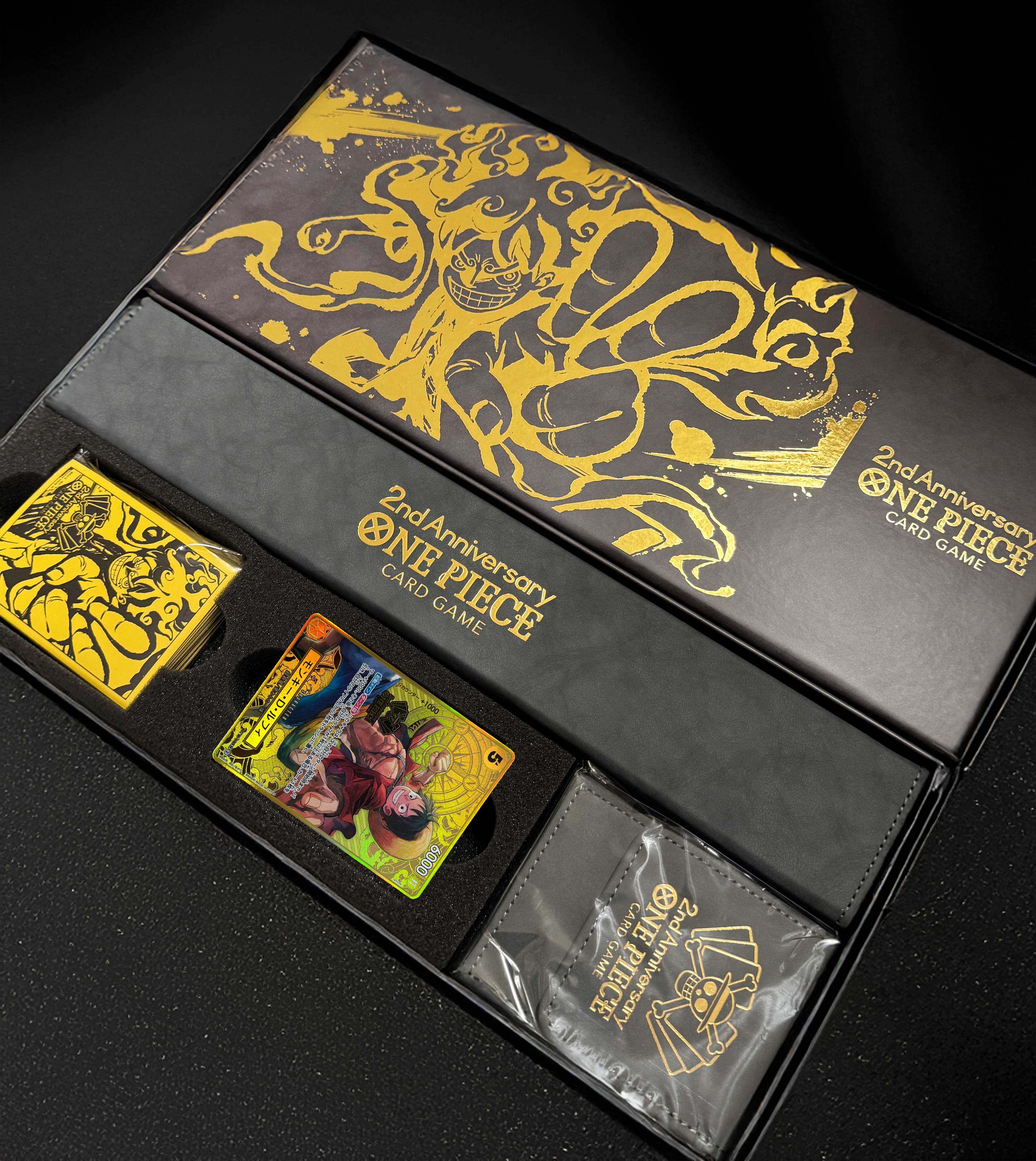 One Piece card game japanese premium bandai 2nd anniversary set - BaronCollections One Piece card game japanese premium bandai 2nd anniversary set - BaronCollections